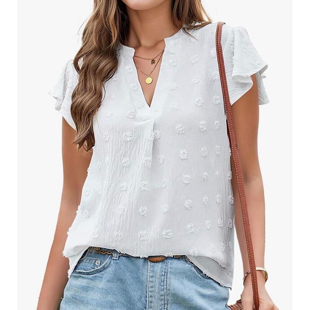 B white notched neck blouse with ruffled cap sleeves and textured Swiss dot patt